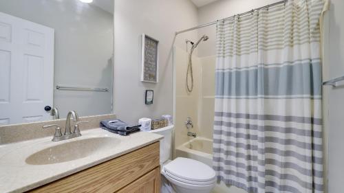a bathroom with a sink and a toilet and a shower at The Nest at Pinecrest by AvantStay Spacious Deck Game Room Fire Pit in Pocono Pines