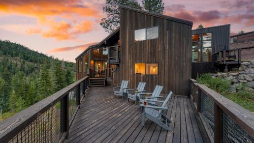 a house on a deck with chairs on it at Trapper by AvantStay A Interior Design w Sauna in Alpine Meadows