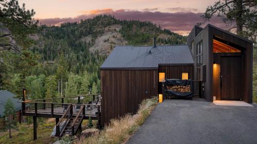 a small house with a view of a mountain at Trapper by AvantStay A Interior Design w Sauna in Alpine Meadows