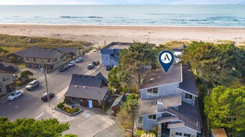 an aerial view of a house next to the beach at Villa Manzanita by AvantStay Hot Tub 1 Block to BeachTown Chefs Kitchen in Manzanita
