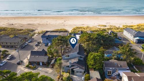 an aerial view of a beach with houses and a road sign at Villa Manzanita by AvantStay Hot Tub 1 Block to BeachTown Chefs Kitchen in Manzanita