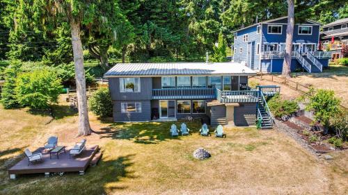 an aerial view of a house with chairs and a porch at Saratoga by the Sea by AvantStay Panoramic View Near Langley in Langley