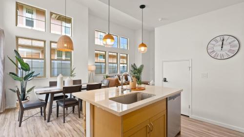 a kitchen with a sink and a dining room at Mauna View by AvantStay 10min to Beach Backyard in Waianae