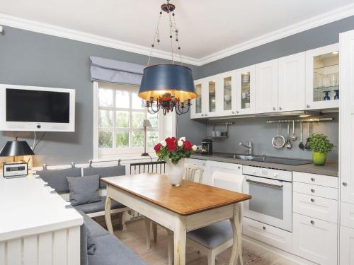 a kitchen with a table and a dining room at Uhlenhof-E in Kampen