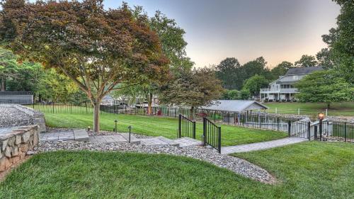 a yard with a fence and a tree at Sip Sip Away by AvantStay Pool Hot Tub in Westport