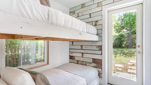 a tiny house with a window and a window seat at Cast Away by AvantStay Stunning Modern Home Near Beach w Two Kitchens in Isle of Palms