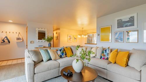 a living room with a couch and a table at Whidbey Bliss by AvantStay 2min to Beach View in Greenbank