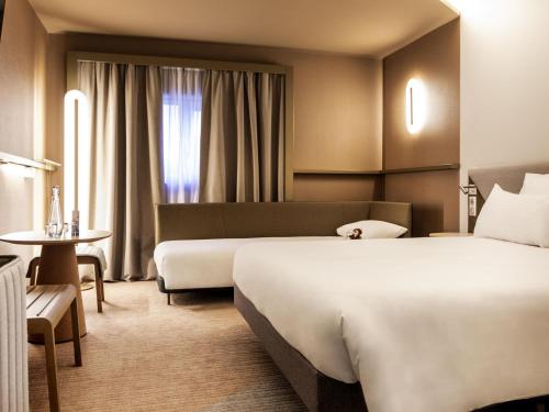 Un ou plusieurs lits dans un hébergement de l'établissement Novotel Paris Orly Rungis Aéroport