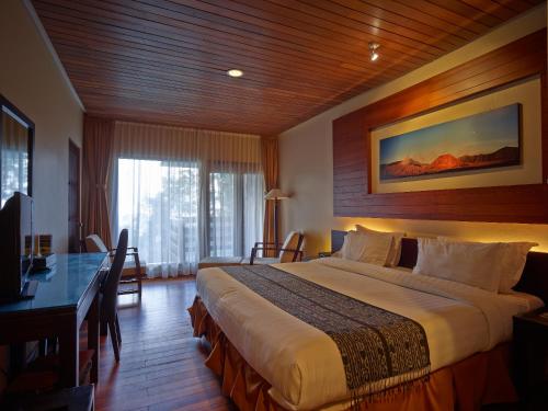 Jiwa Jawa Resort Bromo tesisinde bir odada yatak veya yataklar