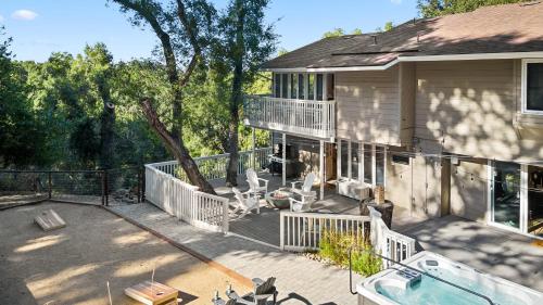 a house with a deck and a swimming pool at Hidden Oaks Farmhouse by AvantStay Hot Tub Deck in Atascadero