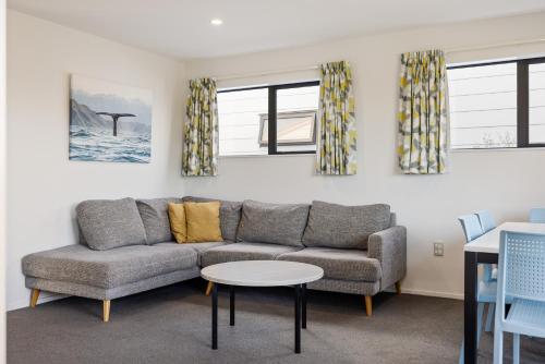a living room with a couch and a table at Kaikōura TOP 10 Holiday Park in Kaikoura