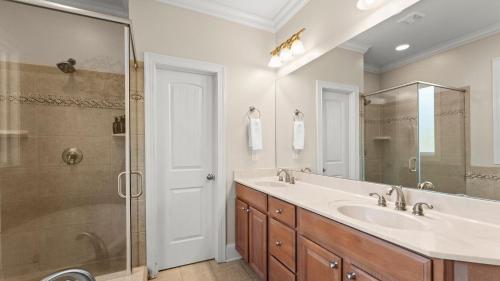 a bathroom with a sink and a shower at Lakefront 6BDR Priv Dock Game Room Firepit Jakes Lake House by Avantstay in Westport