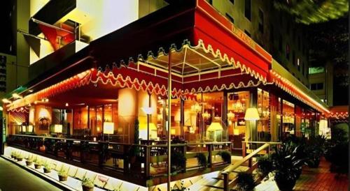 a building with a restaurant with lights on it at Diamond Hotel Tokyo in Tokyo