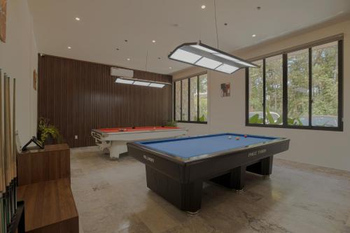 a billiard room with a pool table and two tables at Valley De Mango Hue in Thôn Châu Chữ