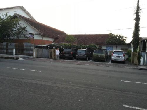 a group of cars parked in a parking lot at Hotel Wijaya Magelang in Magelang