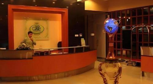 a man standing in front of a counter in a store at Kiulap Plaza Hotel in Bandar Seri Begawan