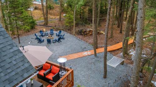 an overhead view of a patio with chairs and a table at Lakeview Sunset Heaven Waterfront Escape Private Dock Firepit Game Room New Construction in Blakeslee