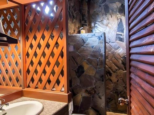 a bathroom with a shower and a sink at Tong Hotel in Maha Sarakham