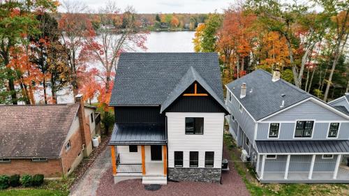 an aerial view of a house at Lakeside Serenity by AvantStay Lakefront Newly Built Deck w Views in White Haven