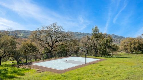 a basketball court in the middle of a field at Malvasia by AvantStay Luxe Wine Country Retreat in Santa Rosa