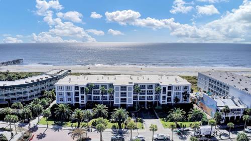 an aerial view of a resort and the beach at Beachfront 3BDR Condo with Pool & Deck Ocean Views Ocean Blvd #102 by AvantStay in Isle of Palms
