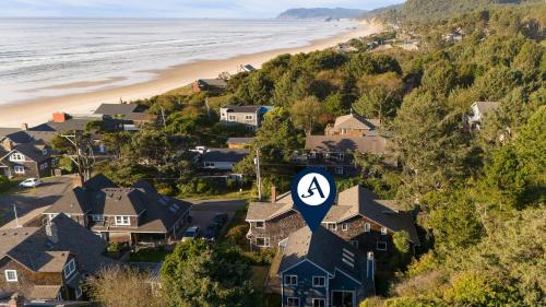 a residential neighborhood with houses and a beach at Royal Canoe by AvantStay Walk to the Shore Private Yard in Arch Cape