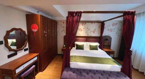 Ein Bett oder Betten in einem Zimmer der Unterkunft GreenTree Inn Luoyang Railway Station Wangfujing Wangcheng Park