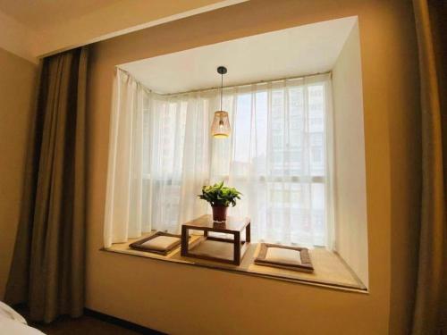 Ein Bett oder Betten in einem Zimmer der Unterkunft GreenTree Inn Luoyang Railway Station Wangfujing Wangcheng Park