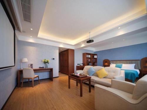 Ein Bett oder Betten in einem Zimmer der Unterkunft GreenTree Inn Luoyang Railway Station Wangfujing Wangcheng Park