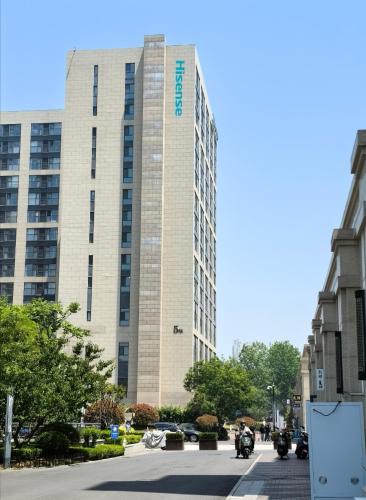 a tall building with motorcycles parked in front of it at Xiao Meow B&B in Qingdao