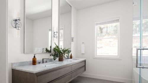 a bathroom with a sink and a mirror at Syrah by AvantStay Hilltop Haven in Sonoma Private Pool Patio in Sonoma