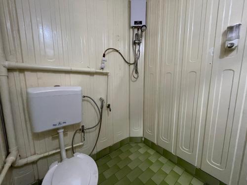 a bathroom with a toilet and a shower at Hotel Riau Holidays in Tanjung Pinang 