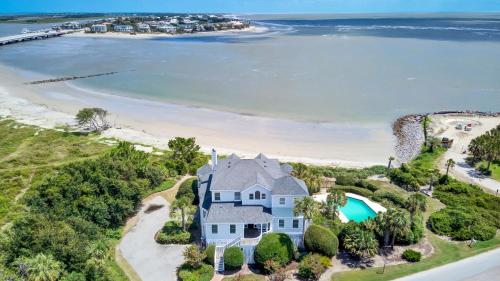 an aerial view of a large house with a beach at Haven by AvantStay Luxury Beachfront Home w Pool Gorgeous Patios in Sullivans Island