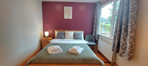 Кровать или кровати в номере Lackandarralodge large 5BR entire house sleeps14!
