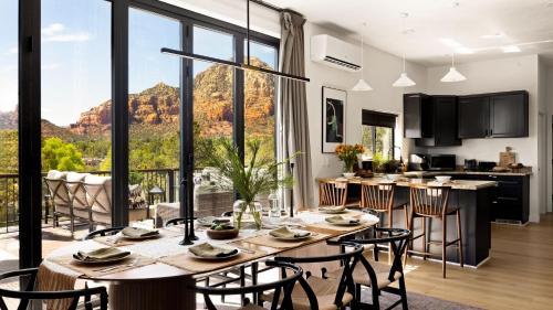 a kitchen and living room with a table and chairs at Roca Roja by AvantStay Mountain Views in the Heart of Sedona in Sedona