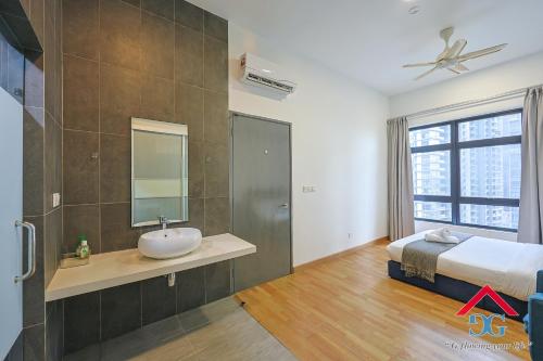 a bathroom with a sink and a bed and a mirror at Astoria Ampang By Grabstay in Kuala Lumpur