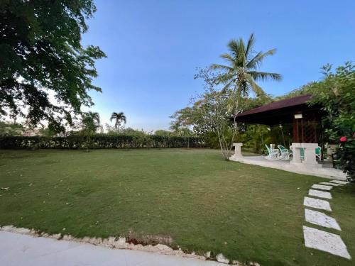 Zahrada ubytování Villa in Metro Country Club, Juan Dolio