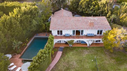an aerial view of a house with a swimming pool at Dume Point by AvantStay Tennis Pool in Malibu in Malibu