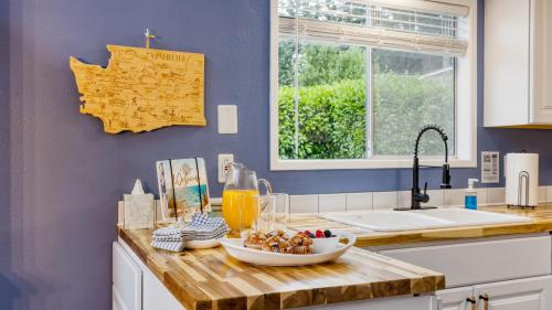 a kitchen counter with a bowl of food on it at Polnell Point Lookout by AvantStay Water Views Hot Tub Large Patio in Oak Harbor