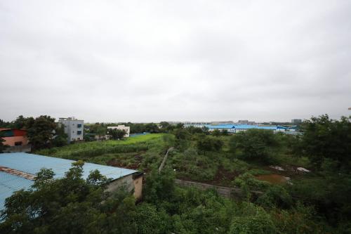 a view of a city with trees and buildings at Azura Vista by Alt Acco in Pune