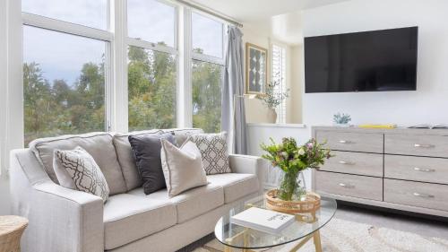a living room with a couch and a tv at Stardust by AvantStay Views Hot Tub Pool Table in Malibu