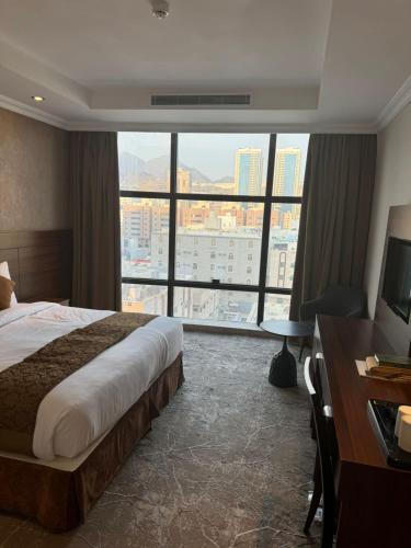 Postel nebo postele na pokoji v ubytování فندق ملتقى الايمان 2 Multaqa Aleiman hotel