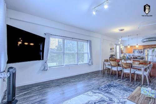a kitchen and dining room with a table and chairs at The Stallion #305 - Walk to Attractions - Modern Spacious 1BD Loft in Memphis Downtown in Memphis