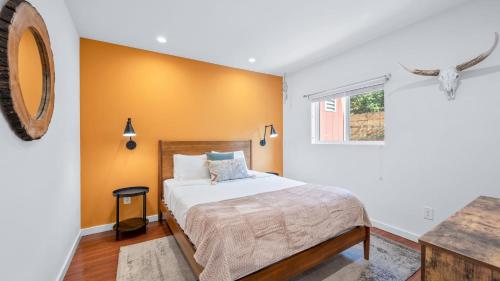 a bedroom with a bed and a window at Southwest by AvantStay Heart of Hollywood Remodeled 1920s Bungalow in Los Angeles