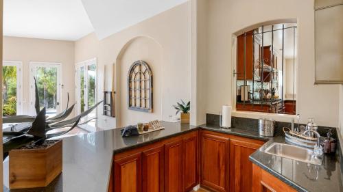 a kitchen with a counter top and a sink at Grapevine by AvantStay Secluded 5BR Villa 4 Acres of Vineyards Avo Groves in Temecula