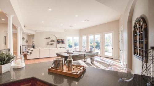 a large living room with a pool table at Grapevine by AvantStay Secluded 5BR Villa 4 Acres of Vineyards Avo Groves in Temecula