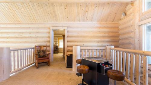 a room with a staircase with a wooden wall at Hot Tub Game Room Large Deck w Incredible View Penticton Lodge by AvantStay in Big Bear Lake