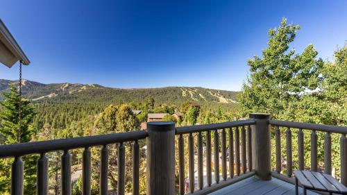 a balcony with a view of the mountains at Hot Tub Game Room Large Deck w Incredible View Penticton Lodge by AvantStay in Big Bear Lake