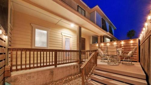 a house with a deck with chairs on it at Pool Walk to Old Town Eateries Nightlife Shopping Rock N Reelby AvantStay in Port Aransas