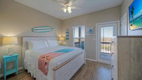 a bedroom with a bed and a ceiling fan at The Beautiful Place by AvantStay Mins to Beach Family-Friendly Pool in Padre Island